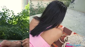 A brunette Asian beauty experiments with a large penis using a cucumber in an open view format