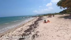 Witness Charly Summer engaging in a passionate chat on the beach and being seduced by a generously endowed unknown man, featuring explicit oral and manual stimulation