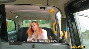 Voluptuous redhead indulges in thrilling experience in a pretend taxi, flaunting her captivating curves