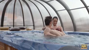 Angie Moon, a young European woman with brunette hair, participates in sexual acts with an older gentleman in different positions near a swimming pool, along with another participant named Conny Dachs