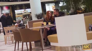 Watch a young redhead receive fingering and oral stimulation from a stranger in a busy shopping area