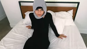 An Arab woman's first sexual encounter on Christmas while dressed in a hijab, engaging in intense intercourse with a generously endowed partner, and showcasing her large breasts and ample derriere